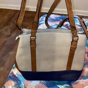 This is a beautiful shoulder bag Navy blue, Tan and Brown